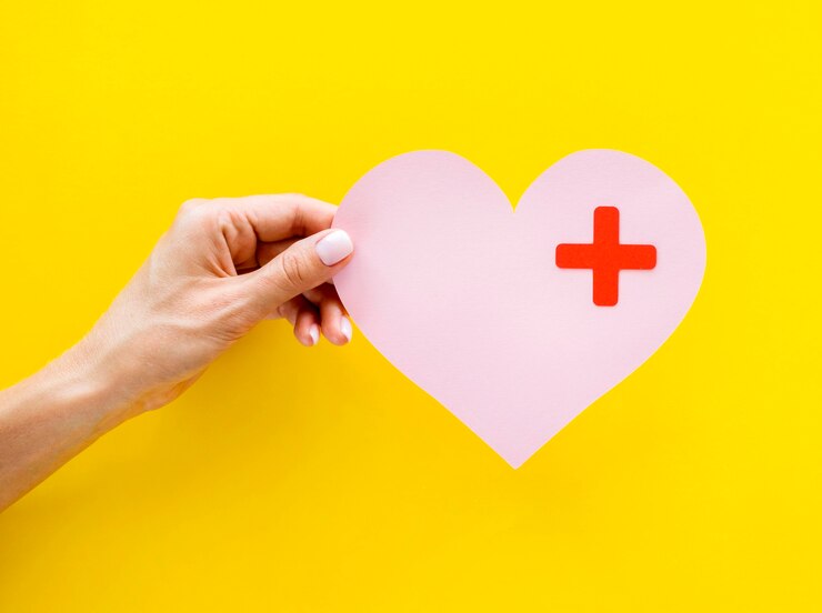 front-view-hand-holding-paper-heart_23-2148635220.jpg