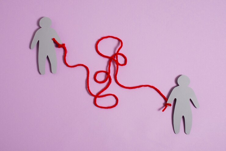 view-red-thread-with-human-figurine_23-2149894051.jpg